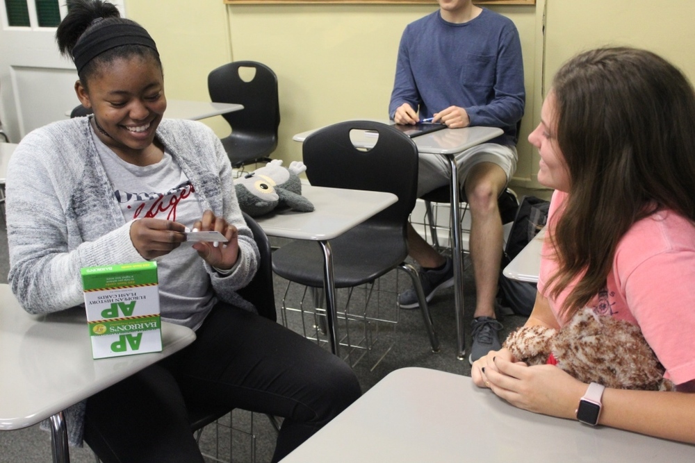 Kianna Ross and Alston Stevenson use review cards to prepare for AP exams.