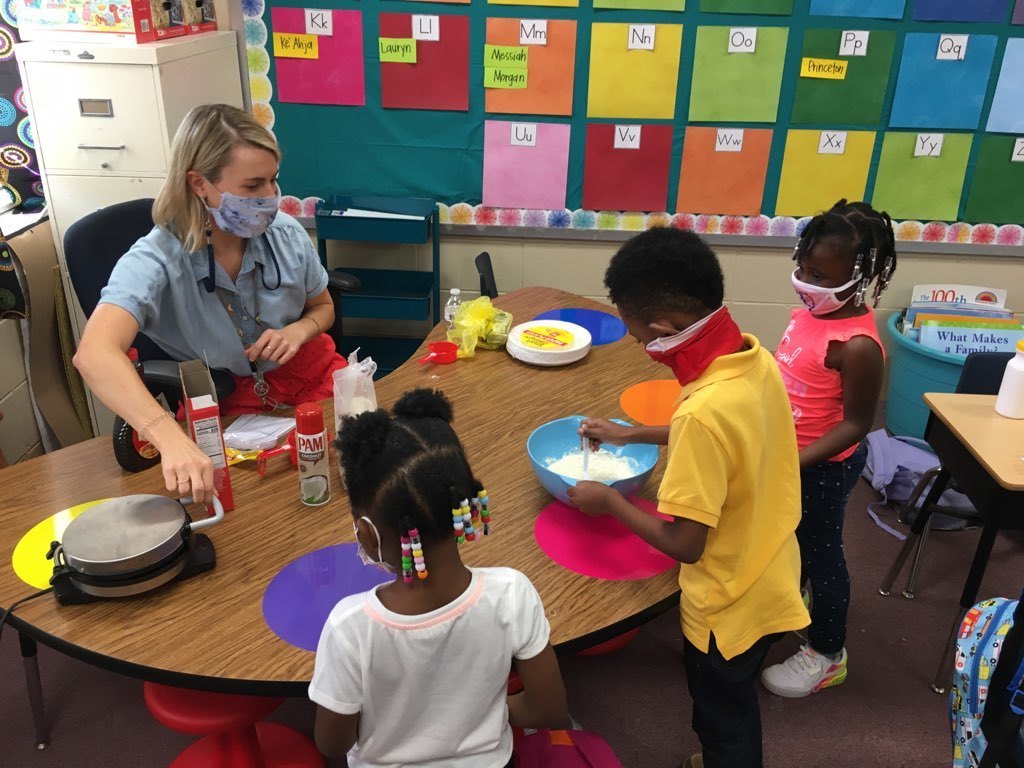 Ms. Cunningham's Kindergarten class at Harper making Mickey pancakes with syrup to focus on the letters M and S.